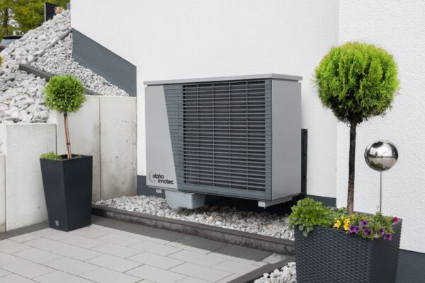 trees and air conditioner by building wall