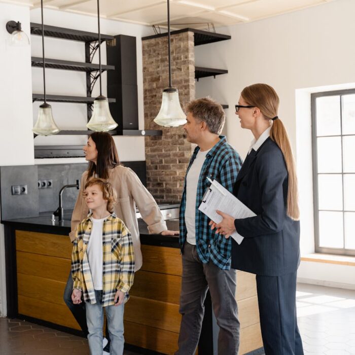 a family with a real estate agent