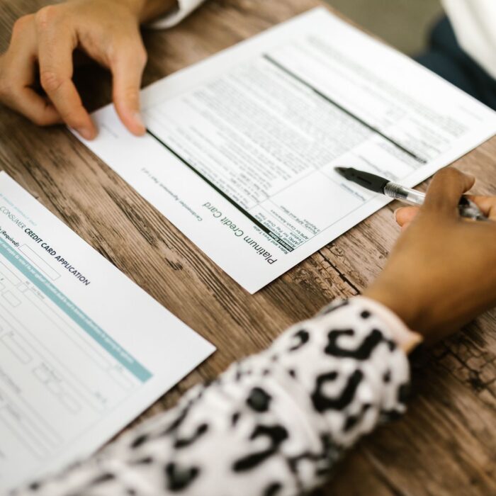 person writing on white paper